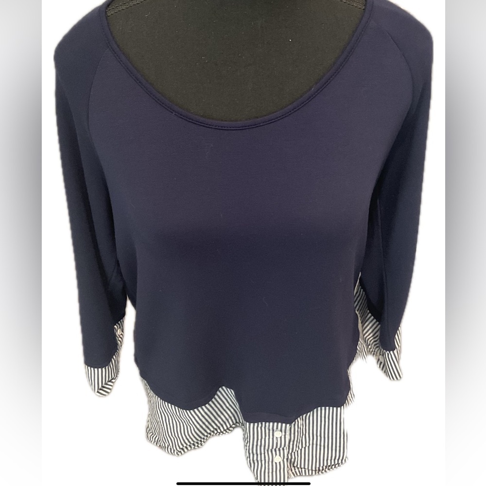 Ricki's Navy Blouse with Striped Hem and split Back .